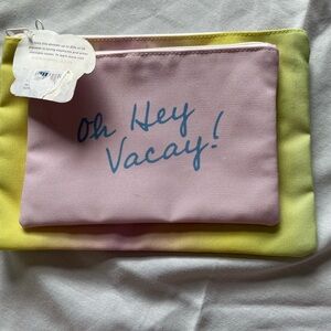 - Ivory Ella  2 make up bags,yellow ombre